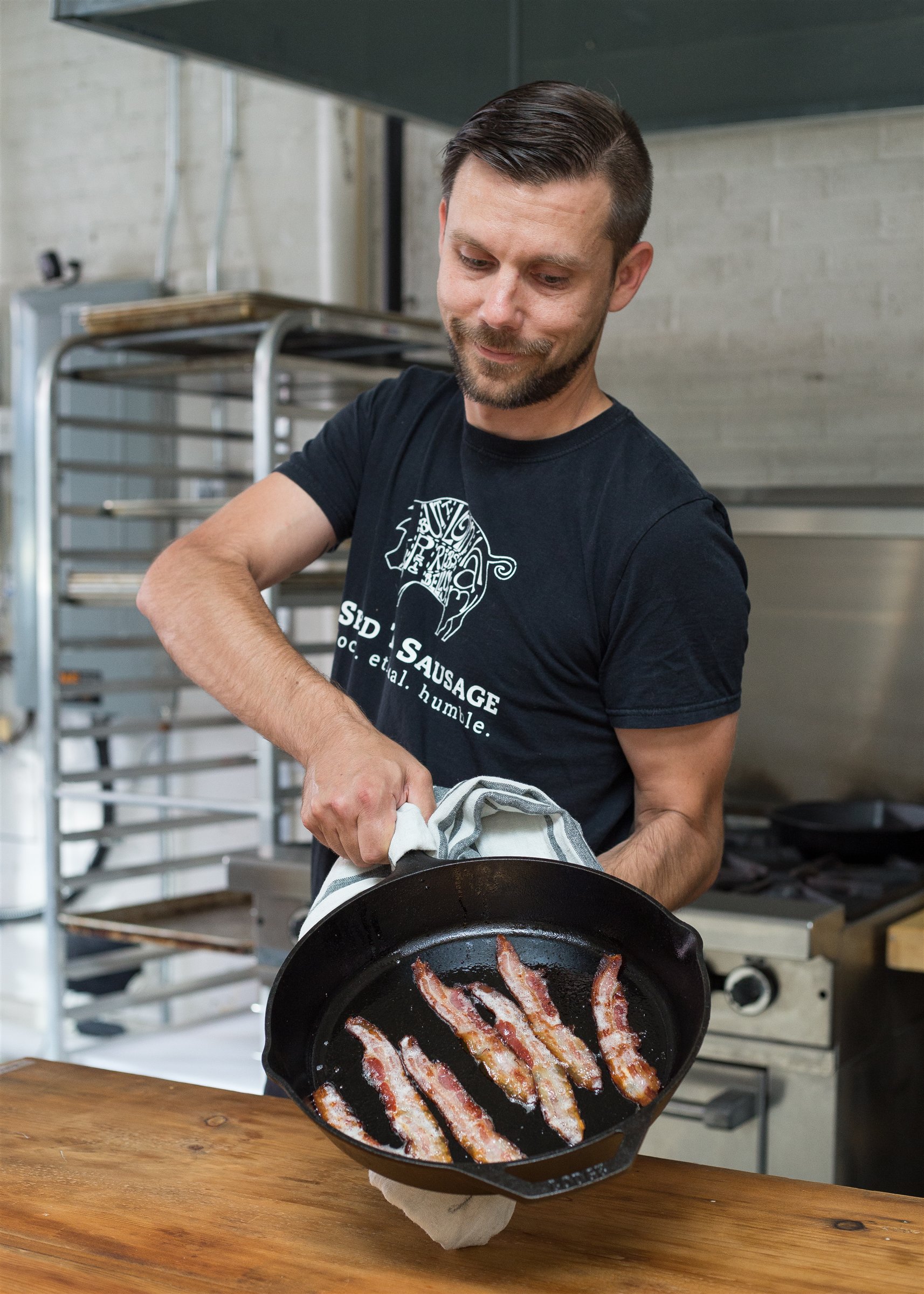 A Seed to Sausage team member working in a production kitchen